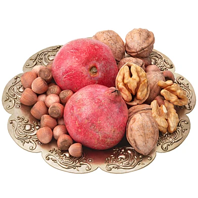 plate of nuts and pomegranates fruits