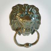 door handle in the form of lion's head