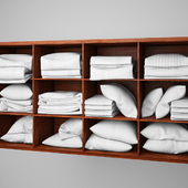 Shelf with pillows and blankets