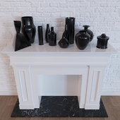 Decorative fireplace and a set of vases