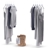 Clothes on hangers and linen basket