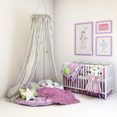Multicolored set for a nursery - a cot, a soft zone with pillows and a canopy and pictures