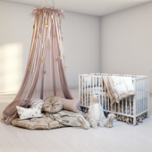 A cozy set for a children&#39;s room with a canopy, a cot IKEA Gulliver and a fluffy rabbit.