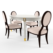 Oval dining table with sliding chairs