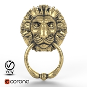 Door handle in the form of a lion&#39;s head with a ring