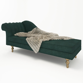 green sofa with knitted blanket