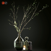 Decorative set with branches and glass bottles