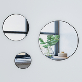 Round mirror in a metal frame