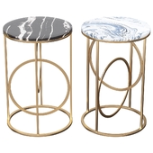 Black round table in marble, table top in metal in gold
