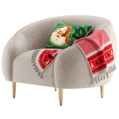 Trudy armchair with Christmas pillow and blanket