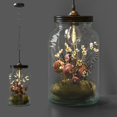 Decorative lamp with dried flowers in a jar.