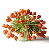 Bouquet of flowers in a glass vase, scarlet tulips