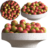 Red plum in fruit bowl