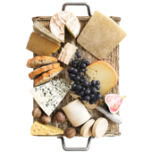 Cheese plate with nuts, grapes