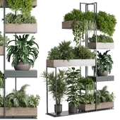 Standing metal shelf with a set of plants in wooden and metal boxes 440