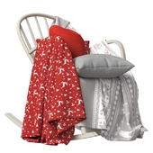 Scandinavian rocking chair with decorative textiles