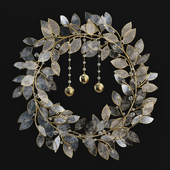 Decorative wreath made of artificial leaves for the wall