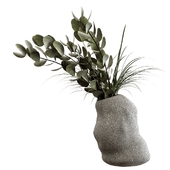 Bouquet in a stone asymmetrical vase