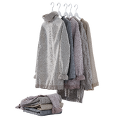 sweaters on hangers and folded