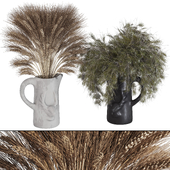 dried wheat and pine tree branches in deer vase