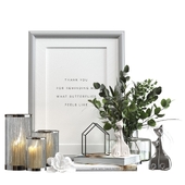 Decorative set with candles and a bouquet of eucalyptus