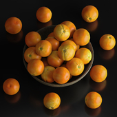 oranges in a ceramic bowl
