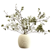 Bouquet of branches in a clay vase