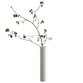 Branch with leaves in a ceramic vase