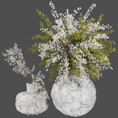 green and white bouquet plants in cement decorative vase 281