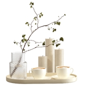Decorative set with candles and cups of coffee