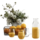 Orange juice with oranges and a bouquet of flowers