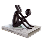 Polymer clay figurine with a book