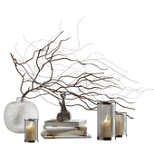 Decorative set with candles and branches in a vase